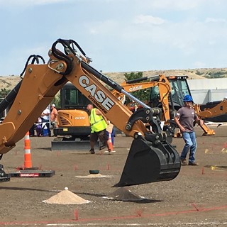 Egg pickup with a backhoe bucket, part of the final relay