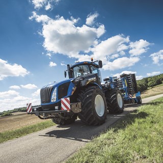 New Holland's T9 565 with Autocommand conducting road transport