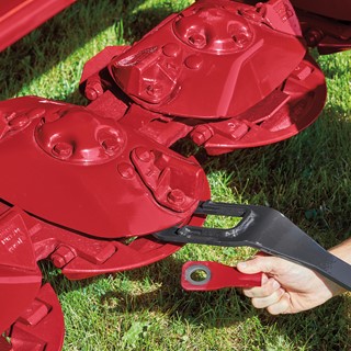 Change knives on Case IH DC3 series disc mower conditioner headers in one-third the time of standard knife system
