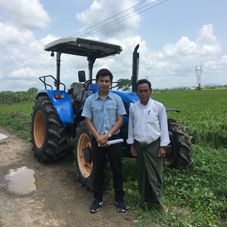New Holland Agriculture customer U Aung Hla in the field with a TT4.75 tractor
