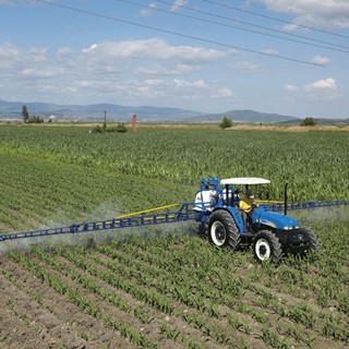 New Holland Agriculture TD90 tractor at work