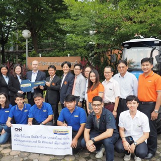 New Holland Agriculture associates and KMITL students with the donated TT55 Tractor