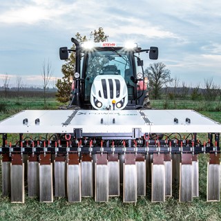 A STEYR tractor using XPower: zero-chemical weed control, through the use of electro-herbicide technology