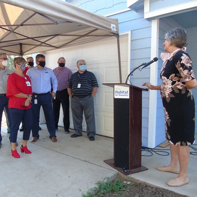 Ann Fox with Habitat Wichita welcomes guests