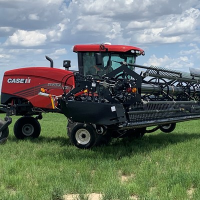 Case IH WD5 Series Windrower with Honey Bee WSC Draper Heads in Transport Mode