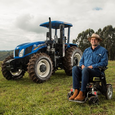 The farmer poses for a photo before work