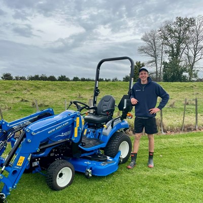 Hugh Jackson presented with New Holland Boomer 25C prize at Roger Gill Agriculture in Huntly