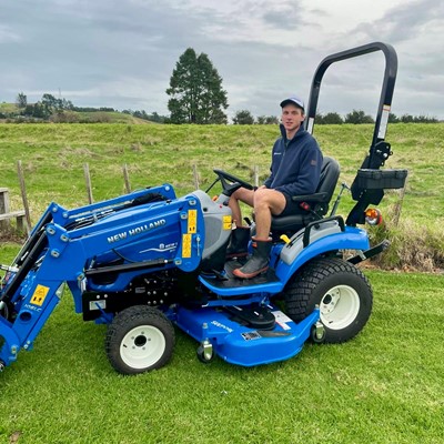 Hugh Jackson presented with New Holland Boomer 25C prize at Roger Gill Agriculture in Huntly