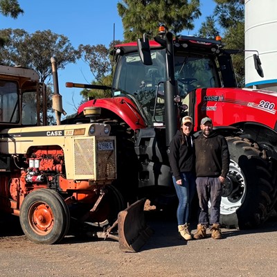 Ben and Melanie McLellan with their current Case IH Magnum tractor and the 1970s Case 830