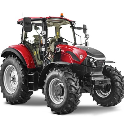 Red and black modern agricultural tractor with large rugged tires, enclosed cabin, and front and rear lights, isolated on a white background.