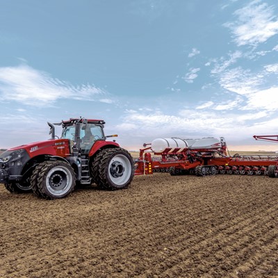 Case IH Magnum trailing the Early Riser 2160 planter