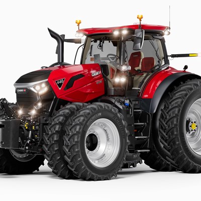 A modern red Case IH 440 tractor with large dual rear tires and dual front tires, featuring a spacious enclosed cabin, front weights, and multiple lights, shown on a white background.