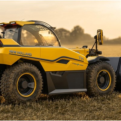 A yellow New Holland TH hybrid power agricultural loader with large rugged tires is parked on a harvested field during sunset, showcasing its modern design and front bucket attachment.
