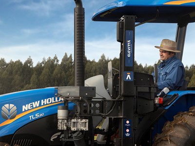 Farmer Fernando Dalmolin operating the accessible tractor mobile armchair device