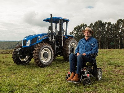 The farmer poses for a photo before work