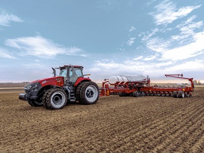 Case IH Magnum trailing the Early Riser 2160 planter