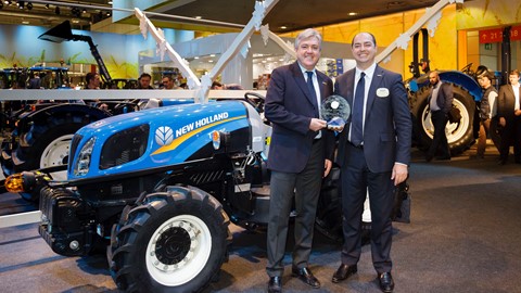 New Holland Agriculture executives accept the award