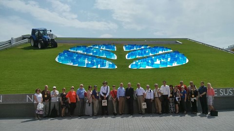 The governor of Nebraska visits the New Holland Agriculture Pavilion at Expo