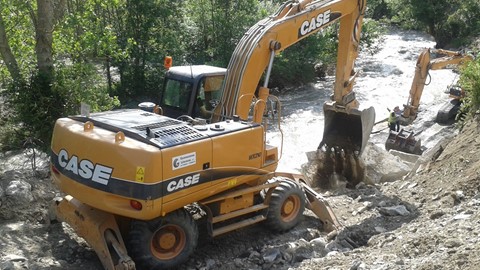 Case WX210 wheeled excavator repairing river banks in Europe following flooding