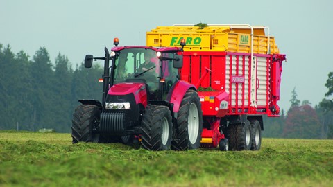 Farmall Pro 115U with a forage wagon