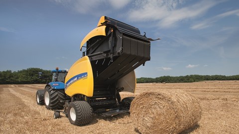 New Holland Roll Belt™ 180 SuperFeed™ ejecting a straw bale