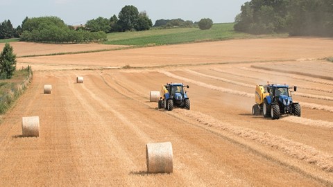 New Holland Roll-Belt™ 180 with the New ActiveSweep™ option baling straw