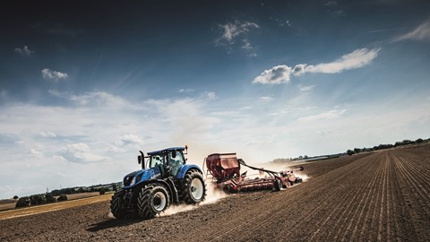 New Holland Agriculture T7.315 Auto Command Heavy Duty with a drill