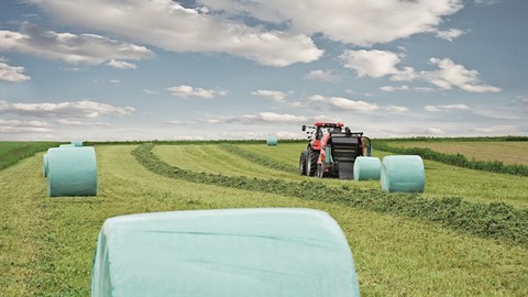 Case IH RB 544 Fixed Chamber Round Baler SilagePack in the Field