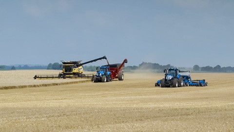 New Holland T8 NHDrive Autonomous Concept Tractor with the 2085 Air Disc Drill alongside a CR Combine and a T8 SmartTrax
