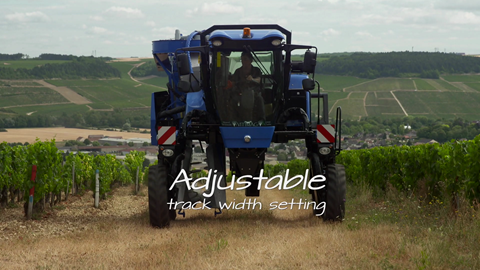 Adjustable track width setting on a New Holland Agriculture grape harvester