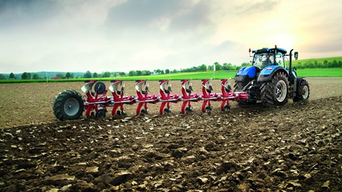 A New Holland tractor working with a plough