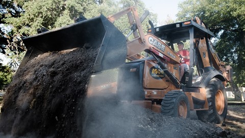CASE 580N working to construct the San Marcos skate park in Texas