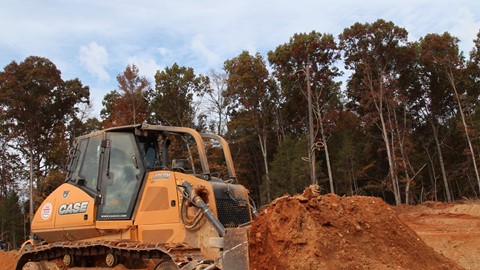 The 2050M matched Coogler's size needs for both transportation and site work