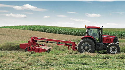 Puma Tractor with a Disc Mower Conditioner at work