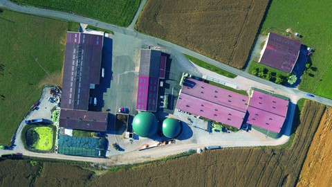 The biodigester domes are at the heart of the farm, alongside the refining unit and traditional farm buildings
