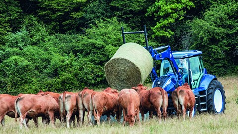 The methane powered concept tractor can be fitted with a loader, here feeding cattle