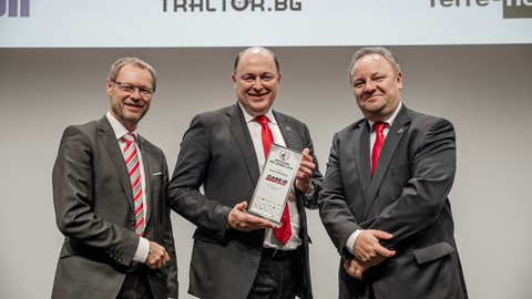 Case IH Brand President Andreas Klauser(center) receiving Machine of the Year for Case IH