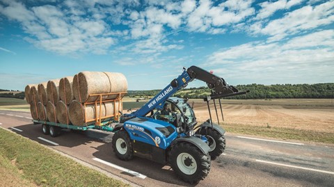 New Holland LM7.42 Telehandler transporting bales