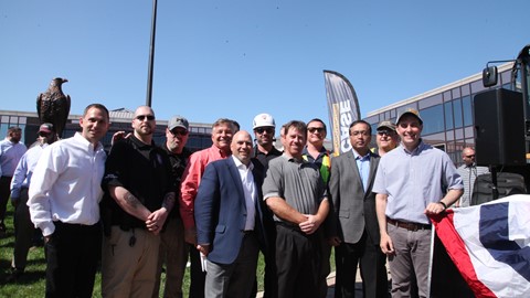 Wisconsin Governor Scott Walker and CNH Industrial VP Scott Harris pose with other contractors and suppliers