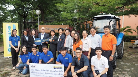 New Holland Agriculture associates and KMITL students with the donated TT55 Tractor