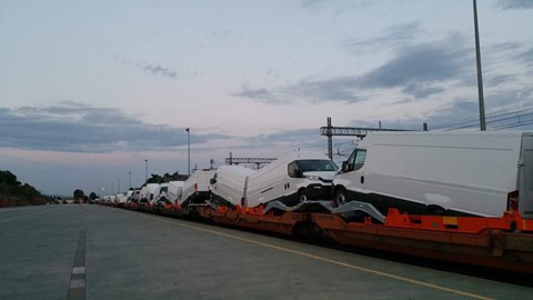 Specially adapted train loaded with IVECO vans