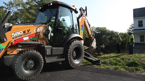 National Grid crews work with the CASE 580 EV