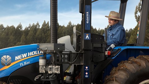 Farmer Fernando Dalmolin operating the accessible tractor mobile armchair device