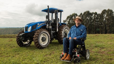 The farmer poses for a photo before work