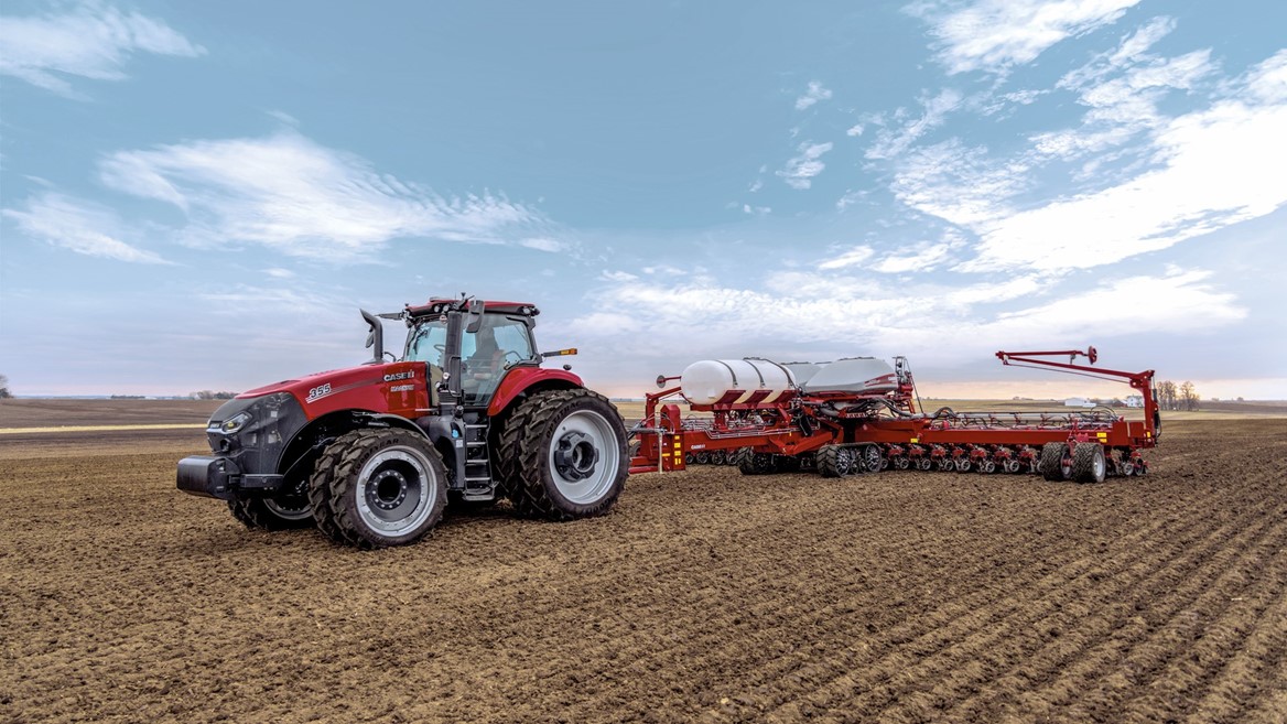 Case IH Magnum trailing the Early Riser 2160 planter