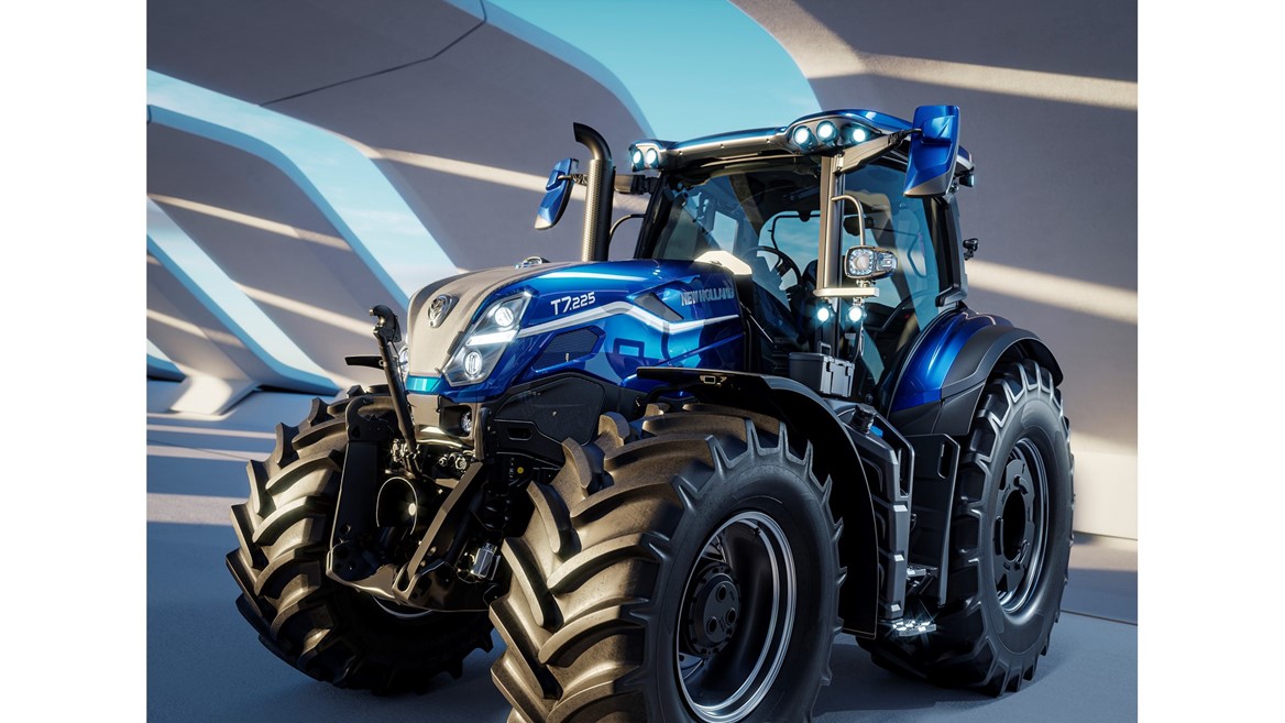 A modern blue New Holland T7.225 tractor with large rugged tires, sleek design, and multiple front and roof lights, parked indoors under a structure with curved beams casting shadows.
