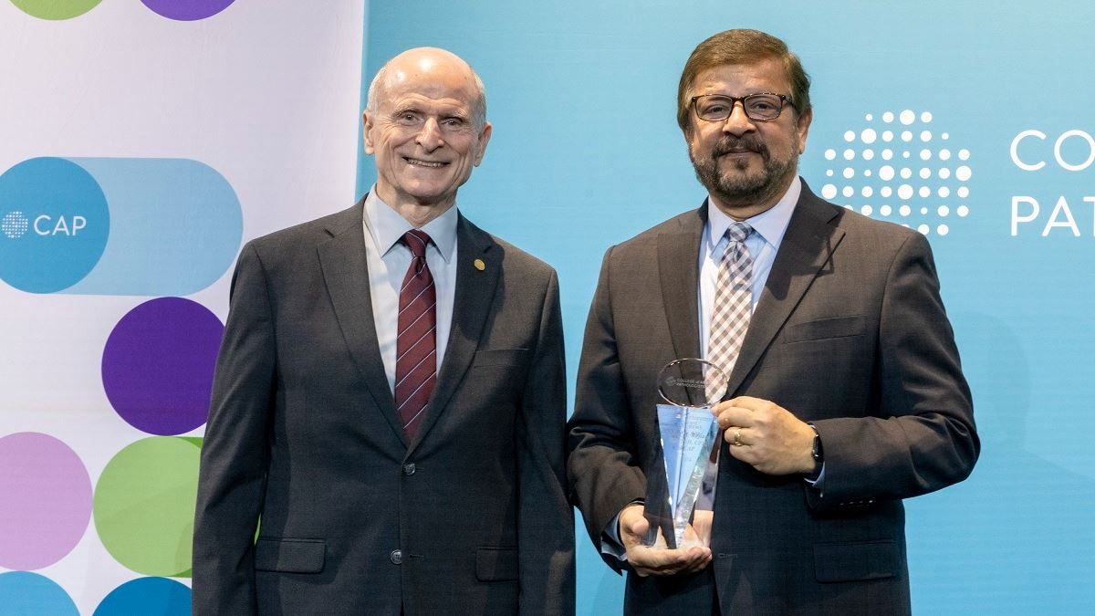 Dr Amyn M Rojiani right has been honored with the College of American Pathologists Lifetime Achievement Award