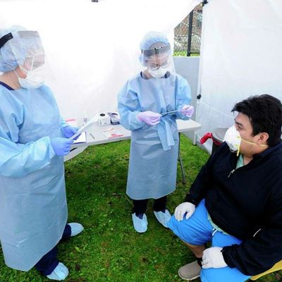 Nurse Practitioners Heather Dawson, DNP and Julianna Barresi, APRN prepare to test Greenwich resident Walter Aucay
