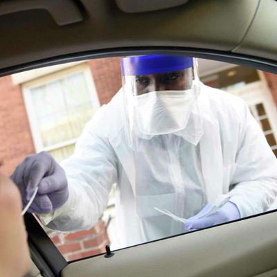 Phlebotomist Warren Dawkins demonstrates drive-thru testing for coronavirus at Murphy Medical Associates in Greenwich