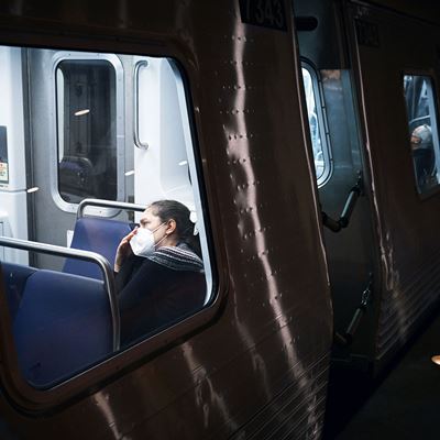 A passenger wears a mask while riding a train passing through the Metro Center station on Thursday January 04 2024 in W